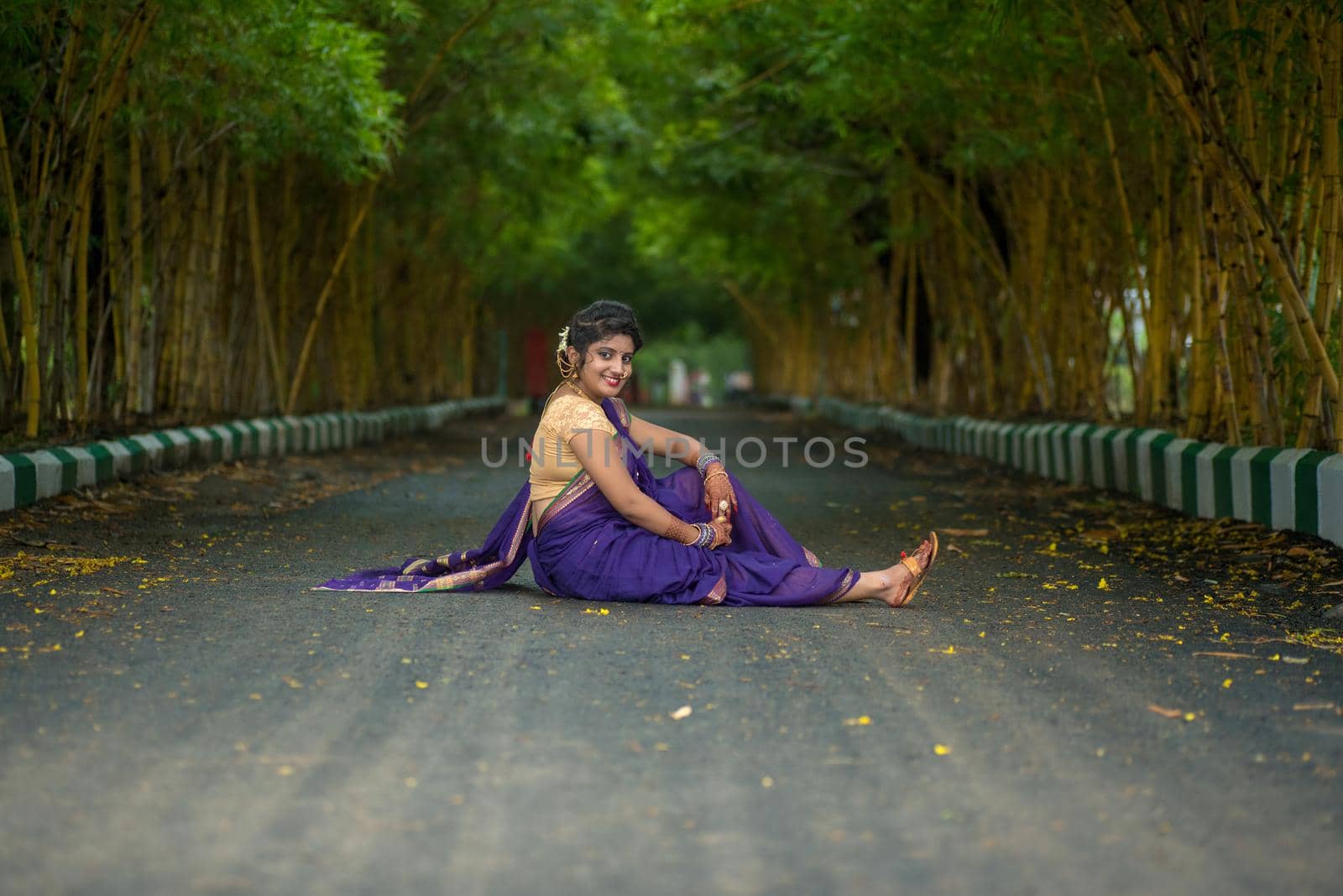 Indian Traditional Beautiful young girl in saree posing outdoors