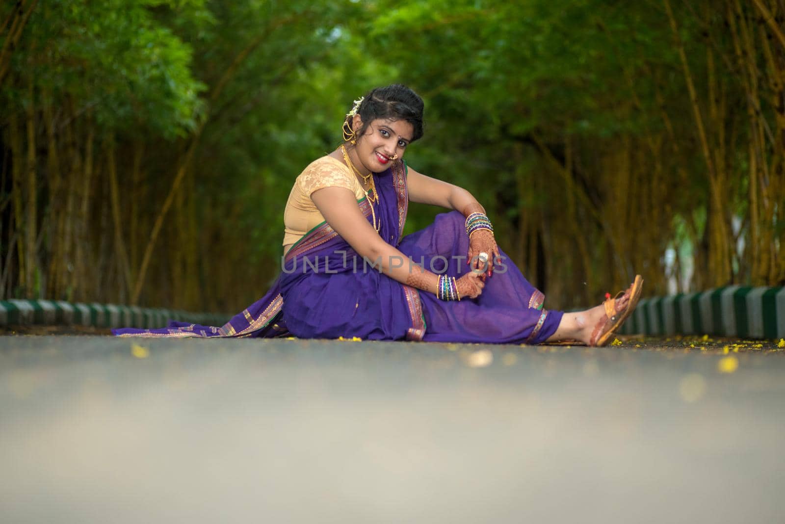 Indian Traditional Beautiful young girl in saree posing outdoors