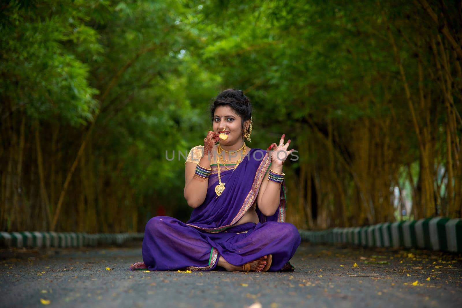 Indian Traditional Beautiful young girl in saree posing outdoors