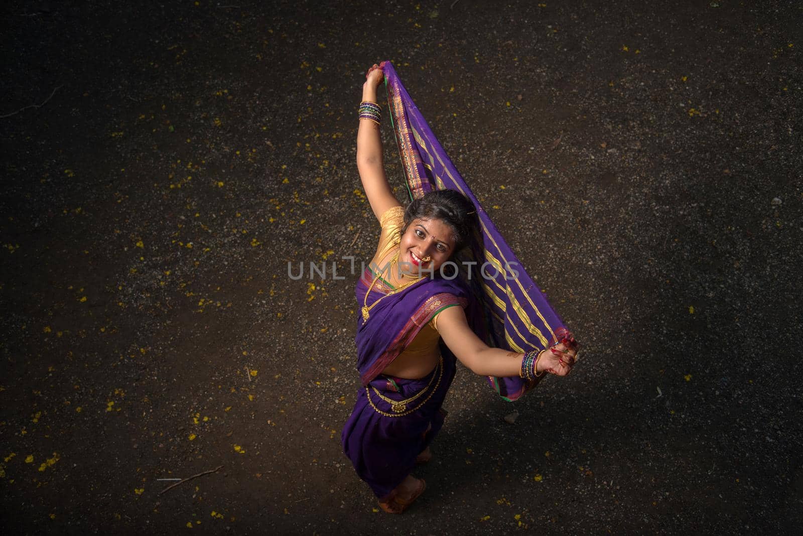 Indian Traditional Beautiful young girl in saree posing outdoors