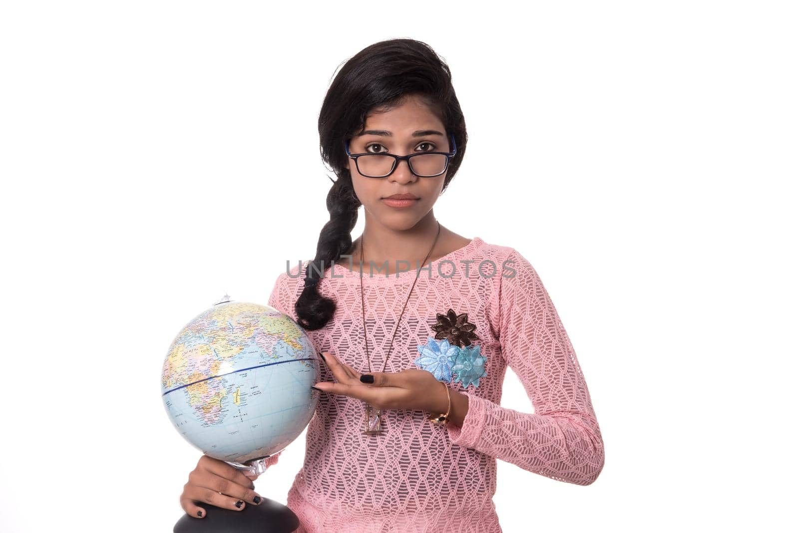 Beautiful Girl holding a world globe isolated on a white background