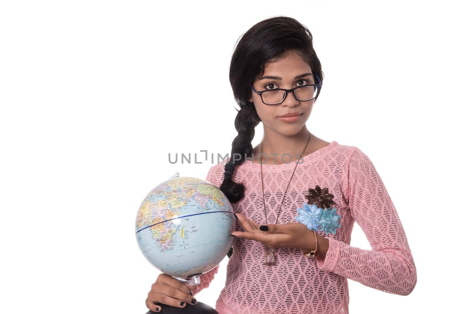 Beautiful Girl holding a world globe isolated on a white background by DipakShelare