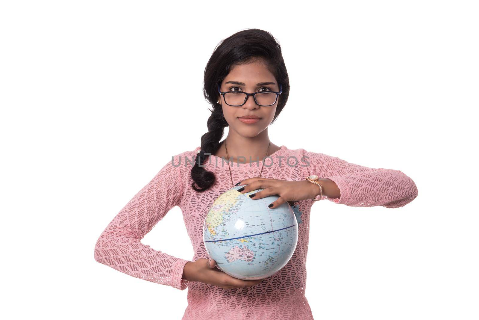 Beautiful Girl holding a world globe isolated on a white background