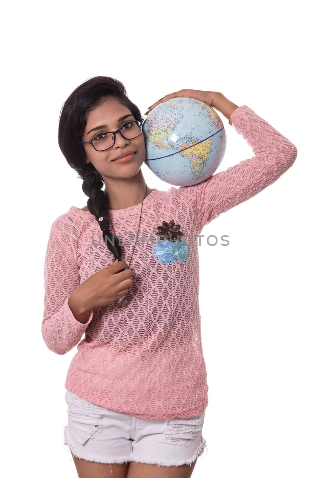 Beautiful Girl holding a world globe isolated on a white background