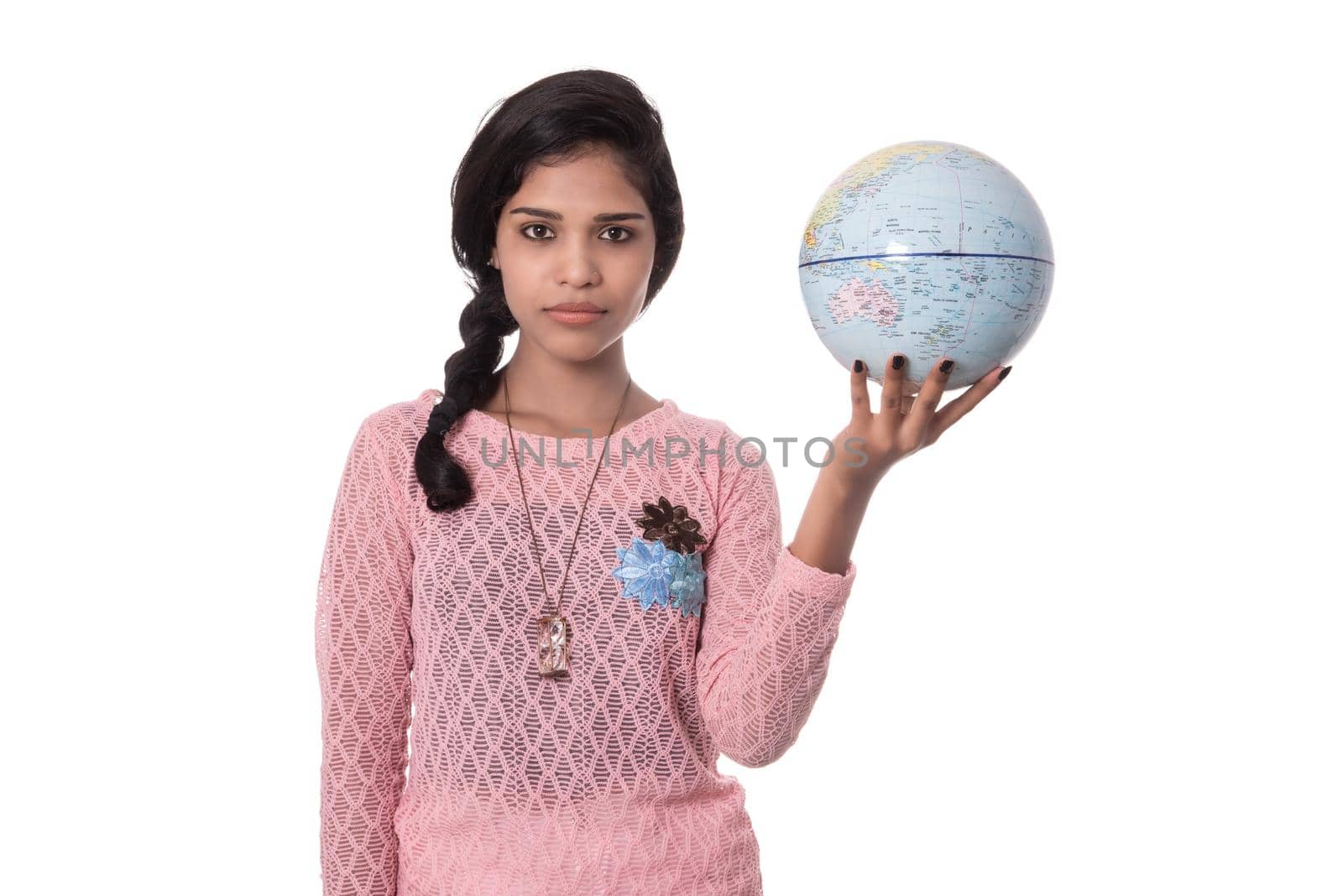 Beautiful Girl holding a world globe isolated on a white background