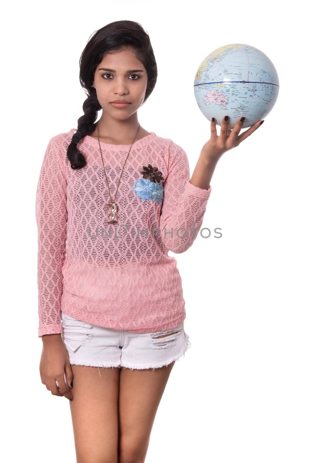 Beautiful Girl holding a world globe isolated on a white background