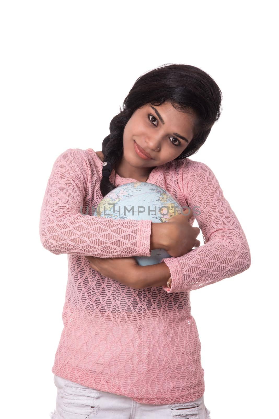 Beautiful Girl holding a world globe isolated on a white background