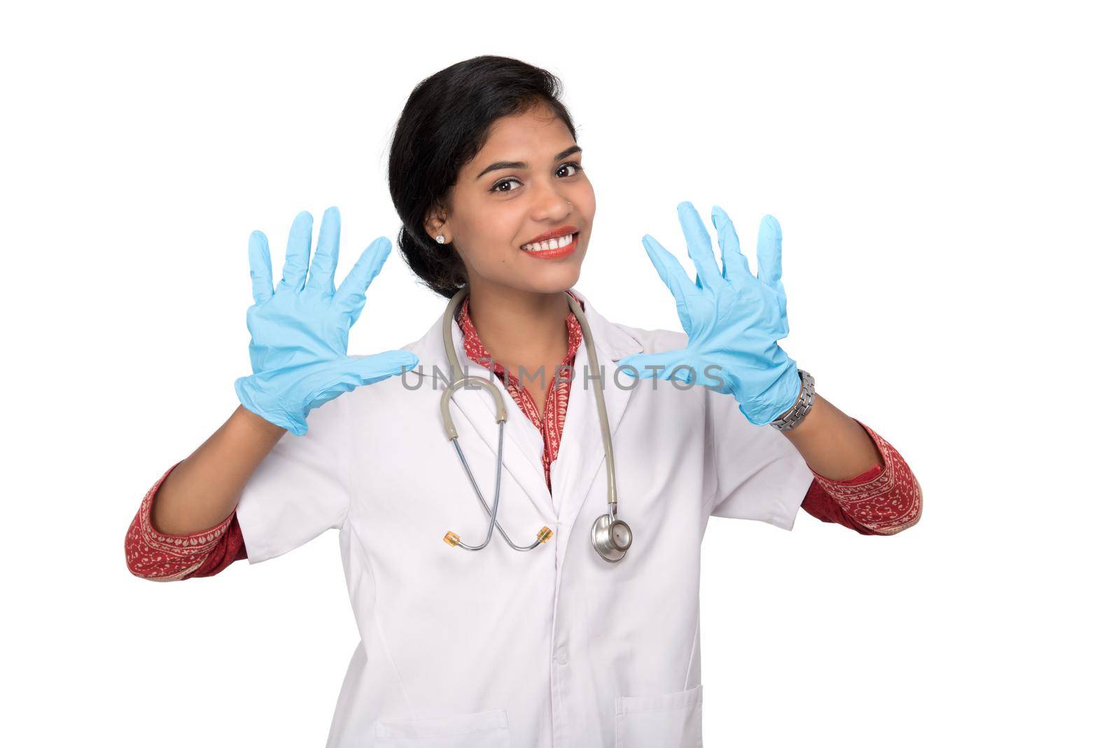 Woman doctor wears medical gloves.