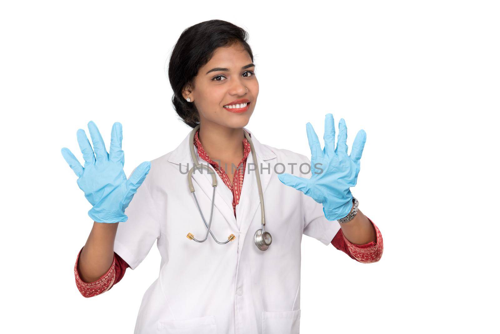 Woman doctor wears medical gloves.
