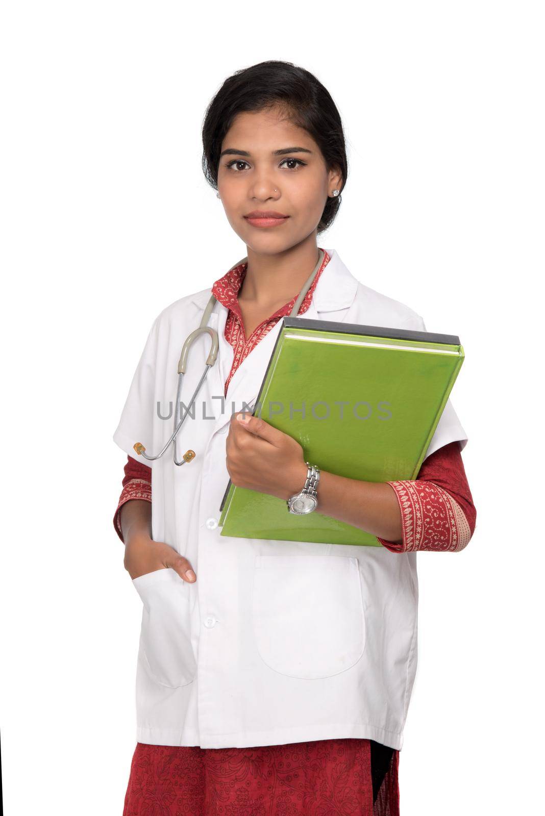 Young woman doctor holding book with stethoscope