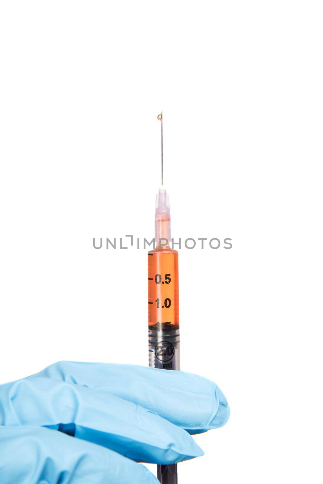 A female doctor with a stethoscope is holding an Injection or Syringe. by DipakShelare