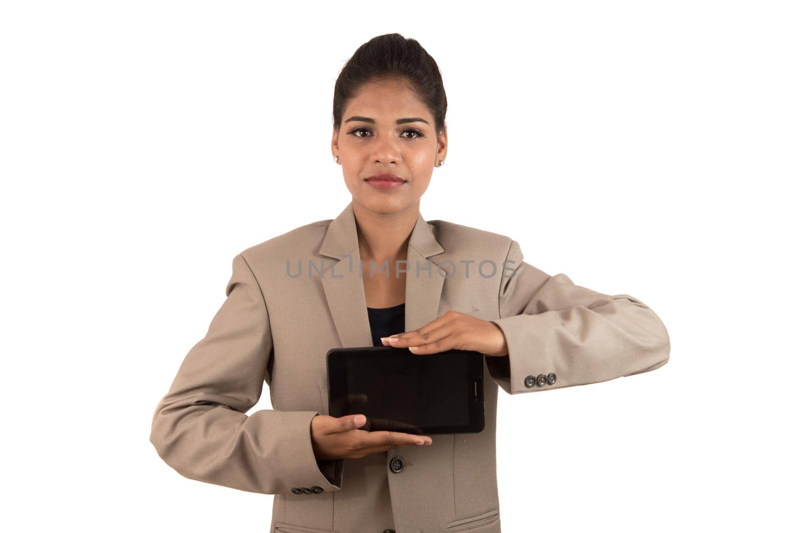 Young beautiful woman holding blank screen smart phone on white background by DipakShelare