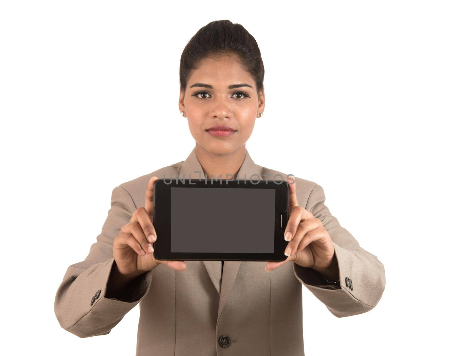 Young beautiful woman holding blank screen smart phone on white background by DipakShelare