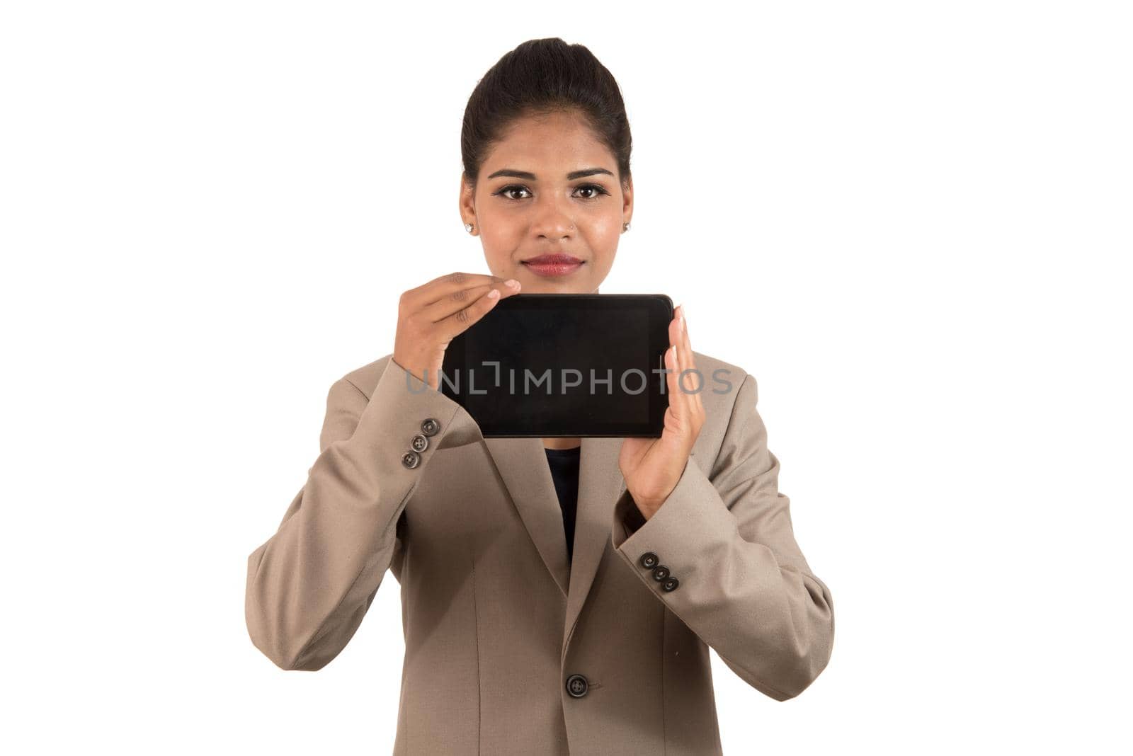 Young beautiful woman holding blank screen smart phone on white background