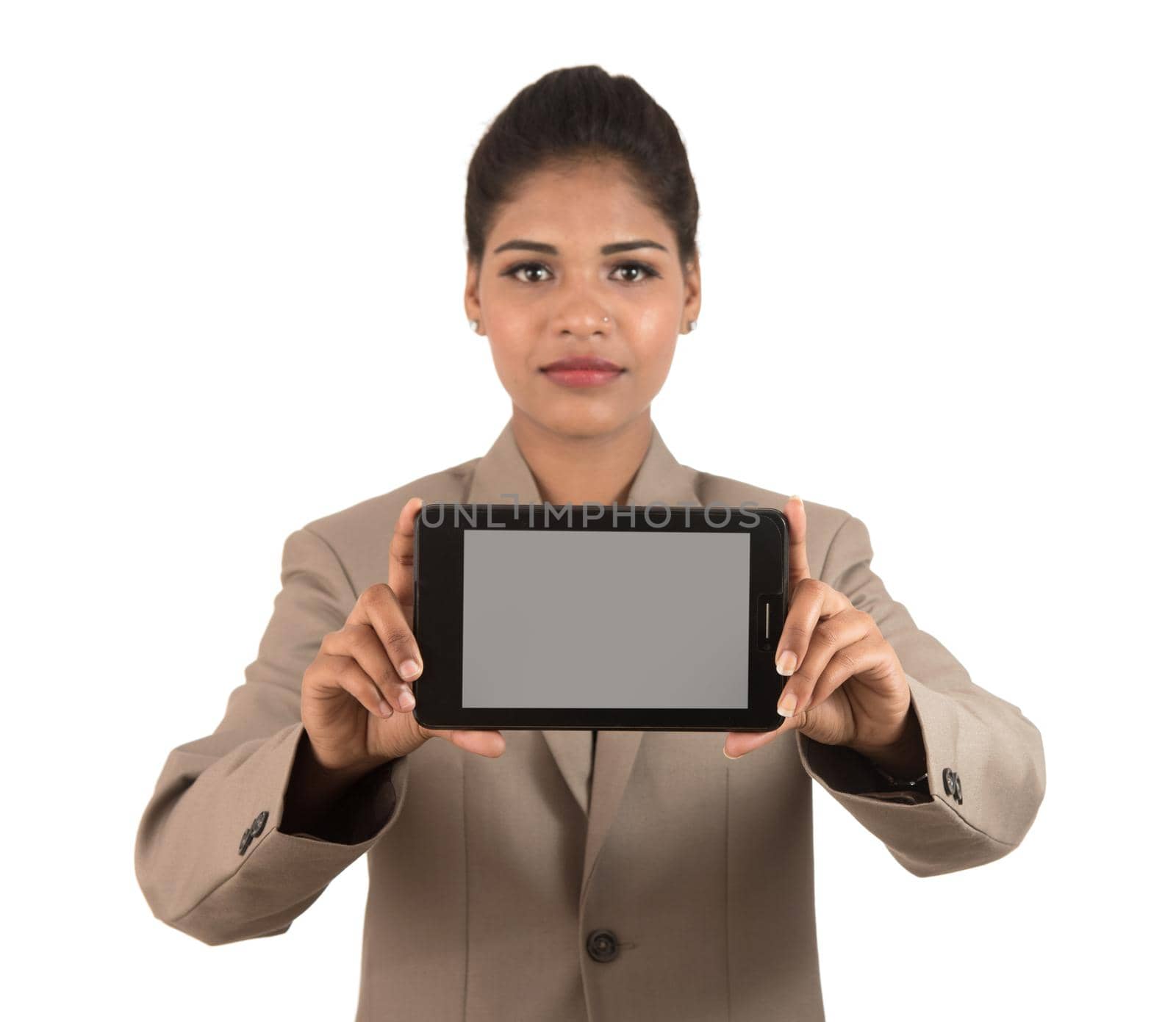 Young beautiful woman holding blank screen smart phone on white background by DipakShelare