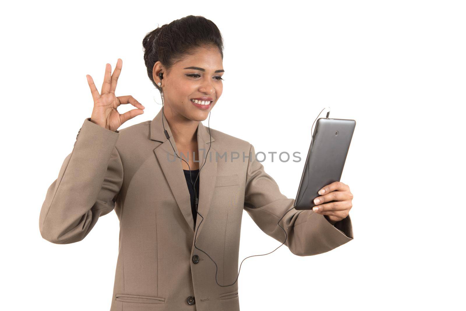 Beautiful woman talking in a video conference online by using smartphone