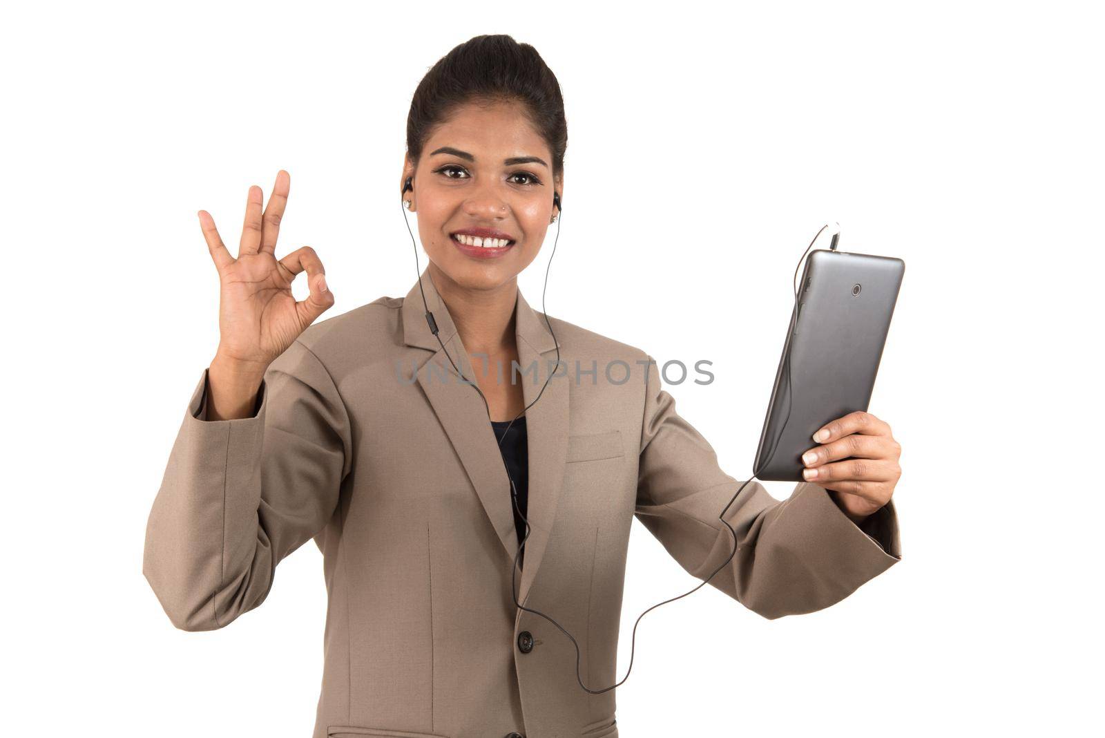 Beautiful woman talking in a video conference online by using smartphone and showing signs by DipakShelare