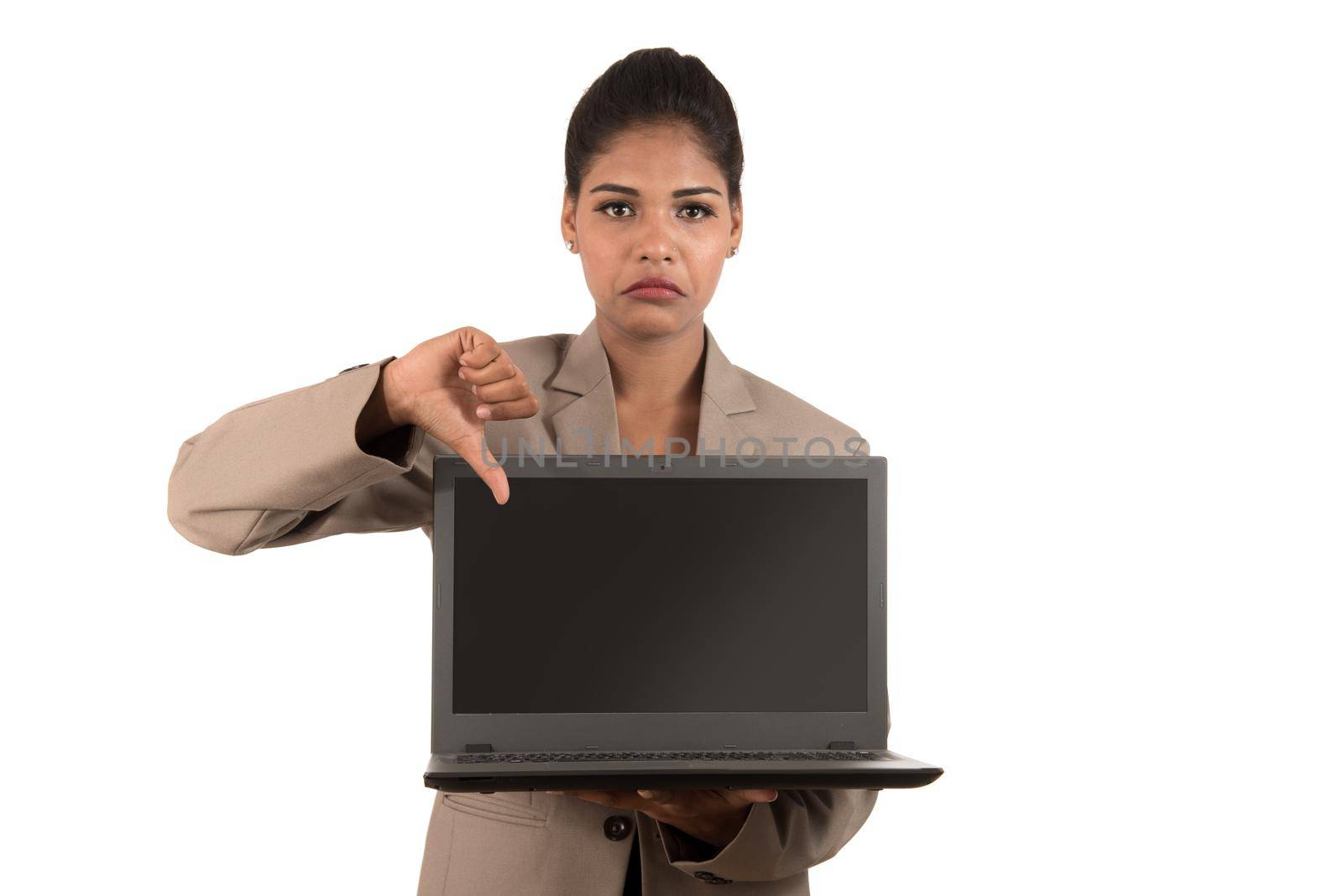 Unhappy business woman holding laptop and showing thumbs down isolated on a white background