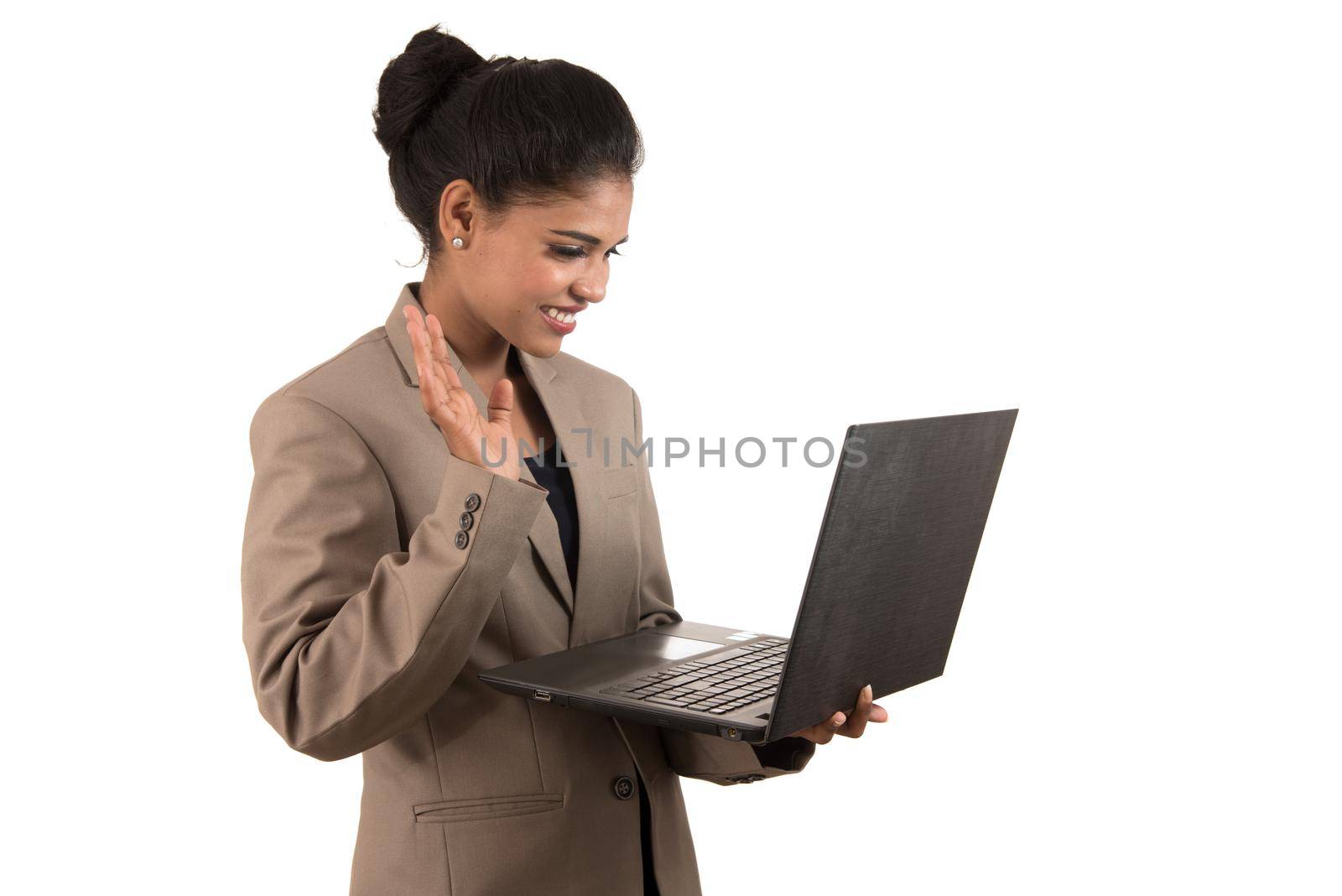 Young happy smiling woman holding laptop.