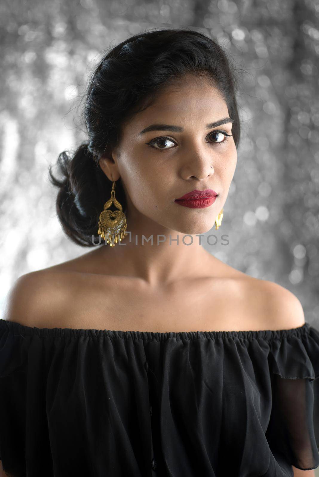 Portrait of beautiful young Girl. Closeup face of a pretty Indian model on texture background by DipakShelare