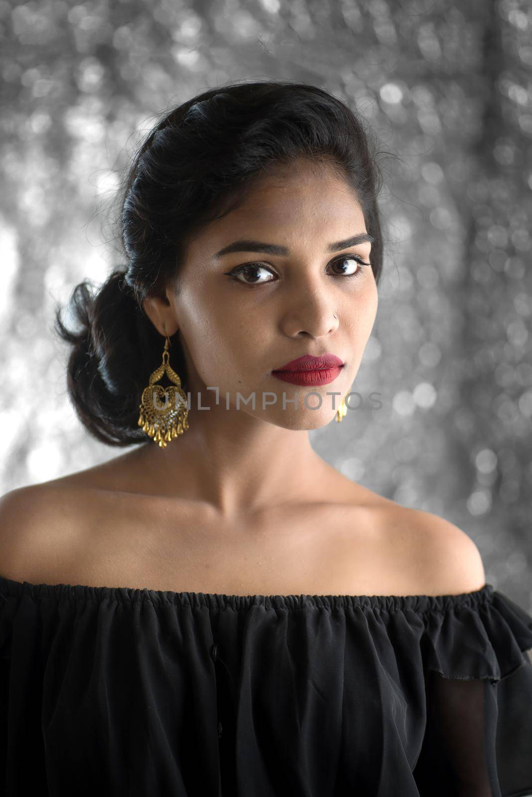 Portrait of beautiful young Girl. Closeup face of a pretty Indian model on texture background