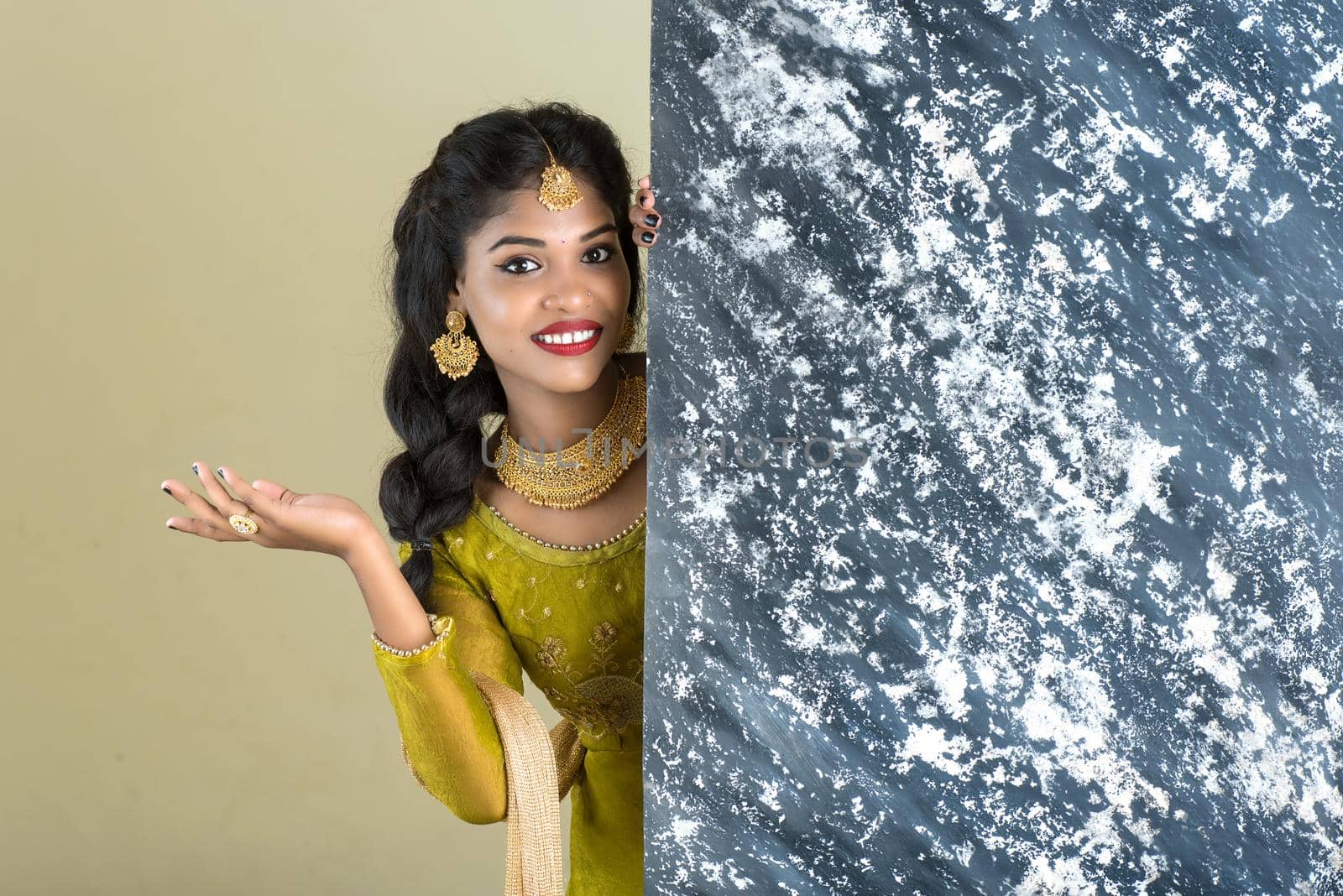 Traditional Girl holding and showing textured board