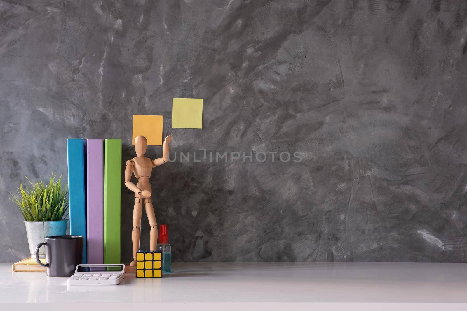 Contemporary Workspace Mock up marble tabletop with notepad, colour pencils, calculator. workspace and copy space for products display montage. by nateemee