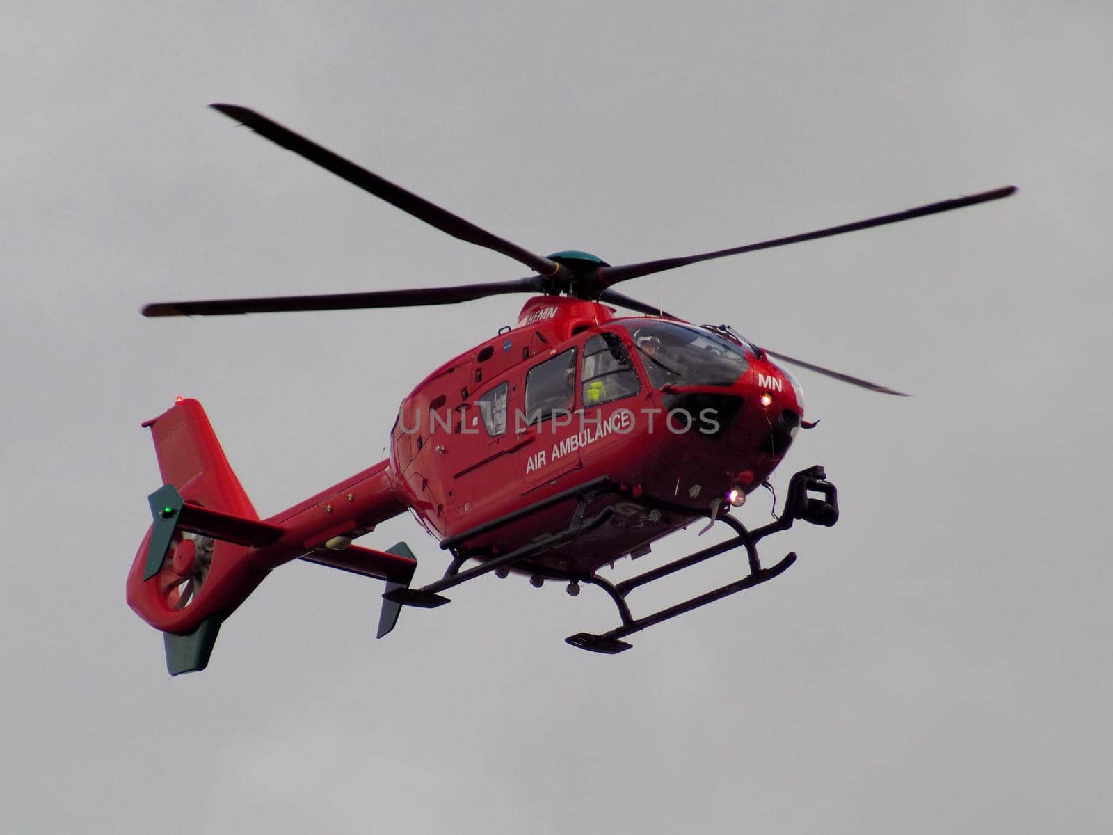 Aldermaston Wharf, Berkshire, UK, April 3 2018: Air Ambulance G-HEMN landing to attend to an emergency
