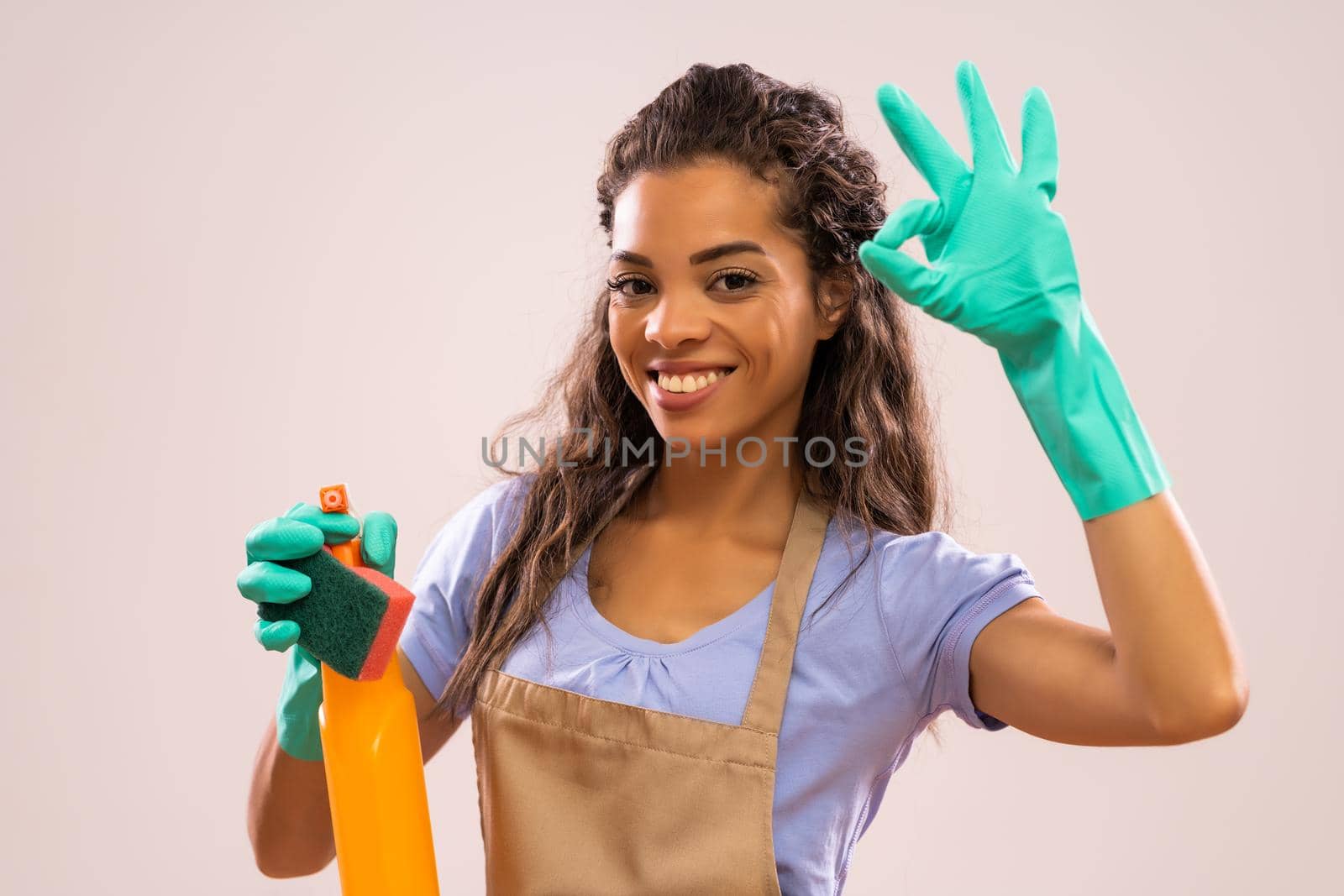 Portrait of happy and successful african-american housewife who is ready for housework.