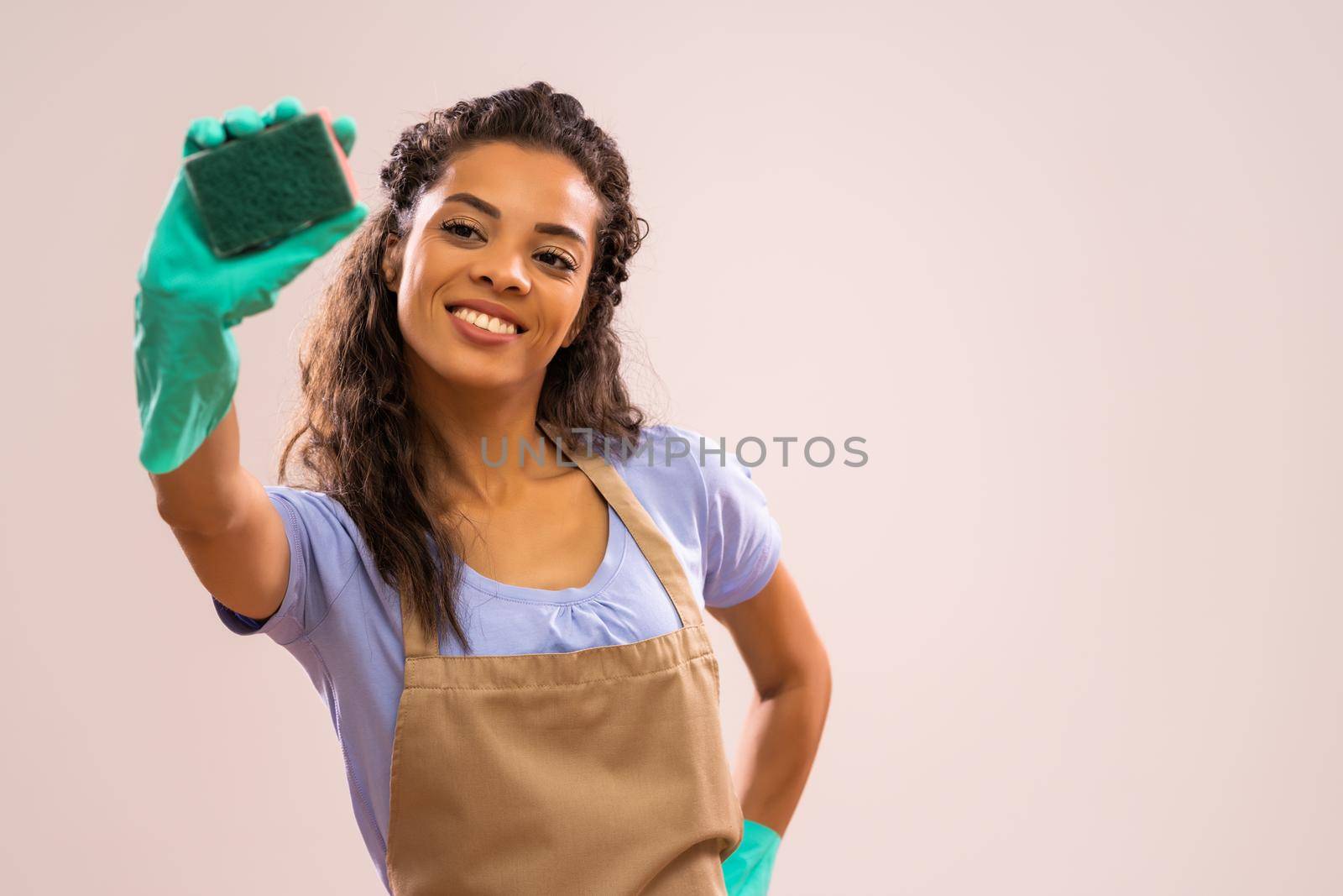 Portrait of african-american housewife who is obsessed with cleaning.