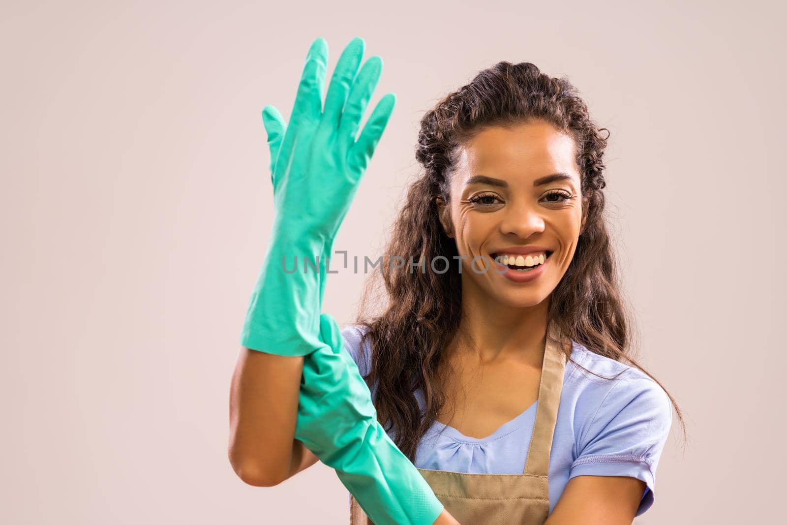 Portrait of happy and successful african-american housewife who is ready for housework.
