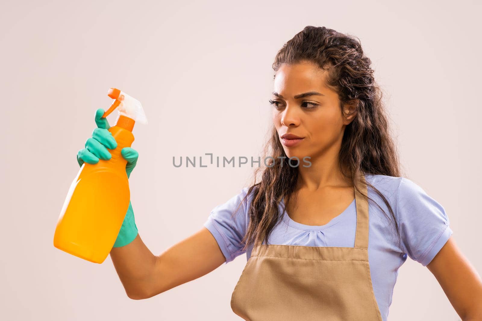 Portrait of african-american housewife who doesn't like cleaning.