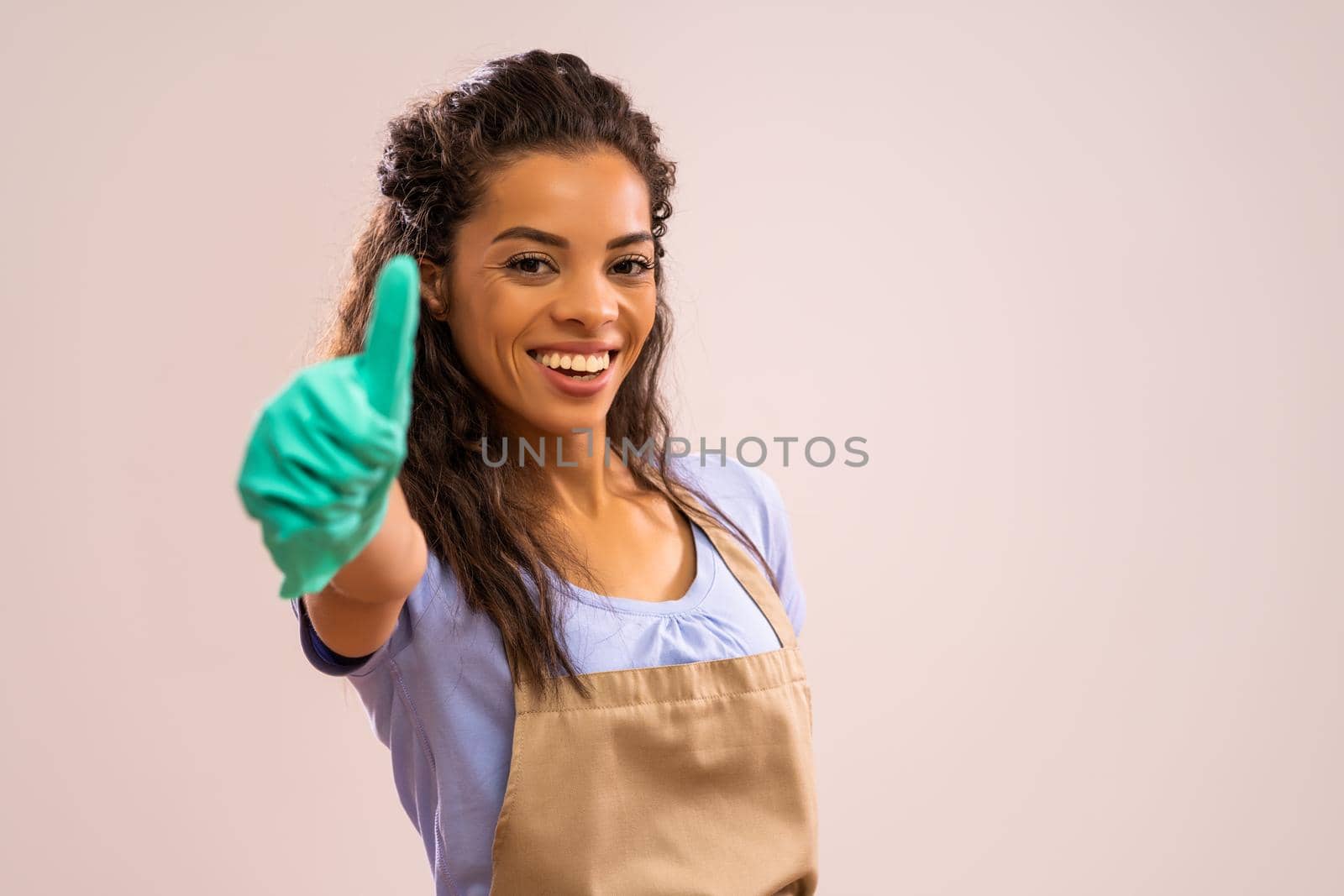 Portrait of happy and successful african-american professional maid.
