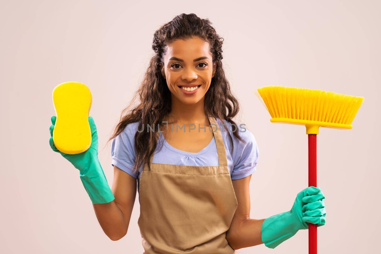 Portrait of happy and successful african-american professional maid.