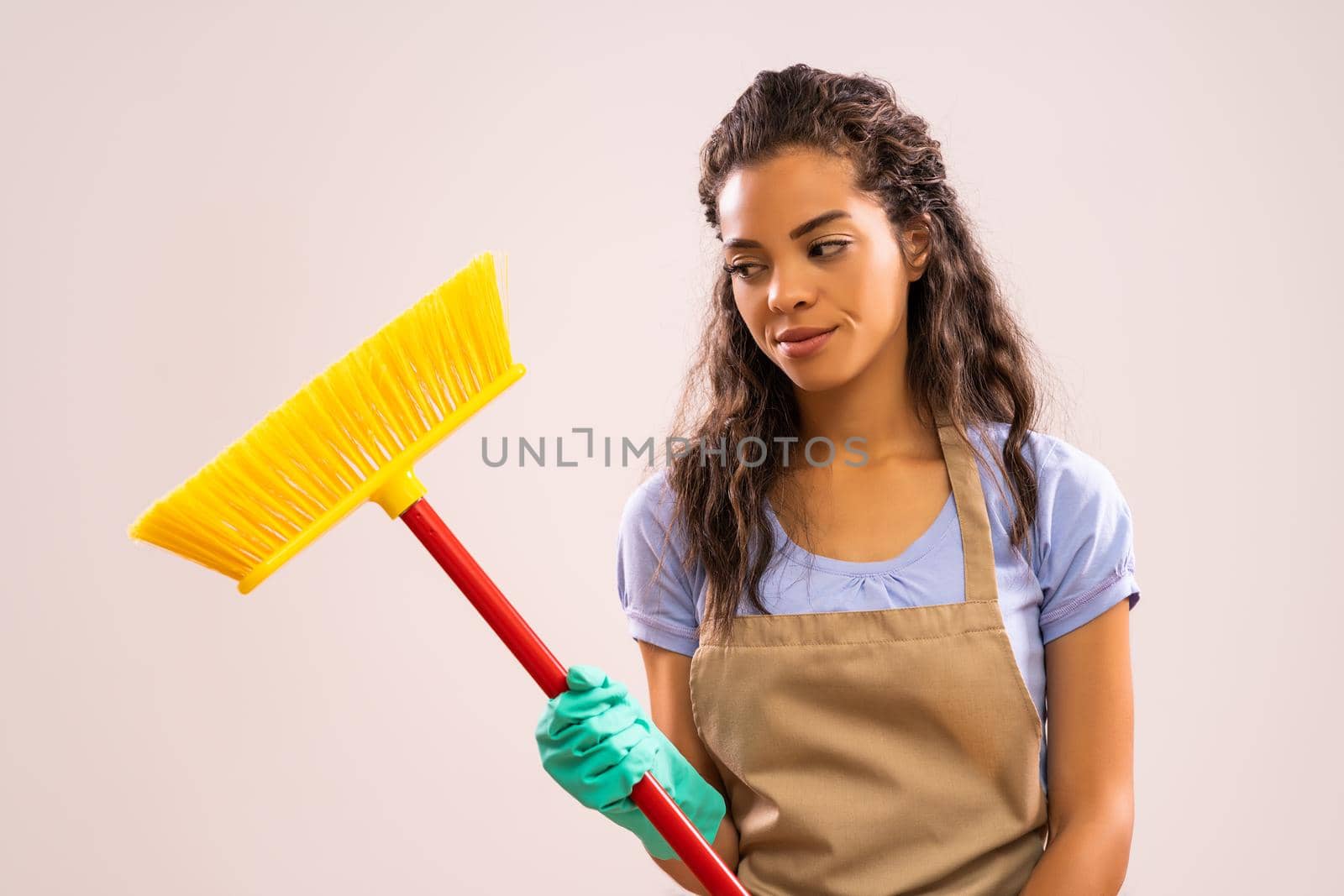 Portrait of african-american housewife who doesn't like cleaning.