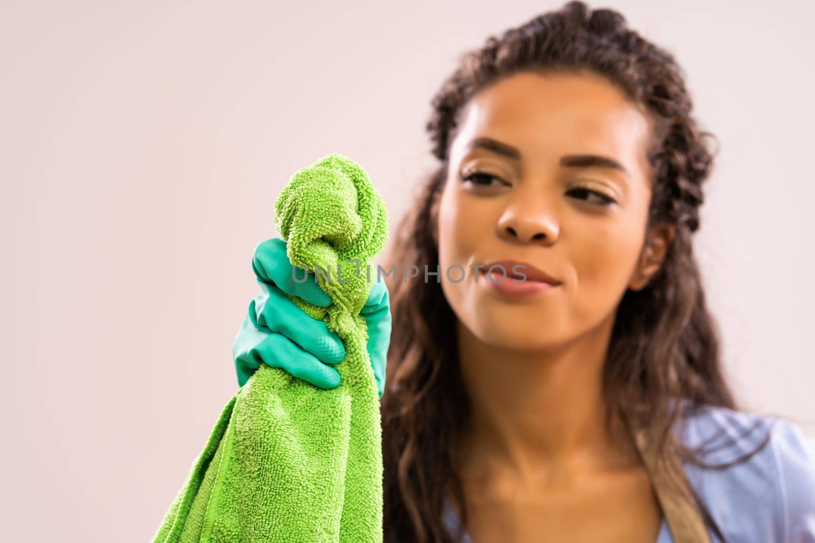 Portrait of african-american housewife who is obsessed with cleaning.