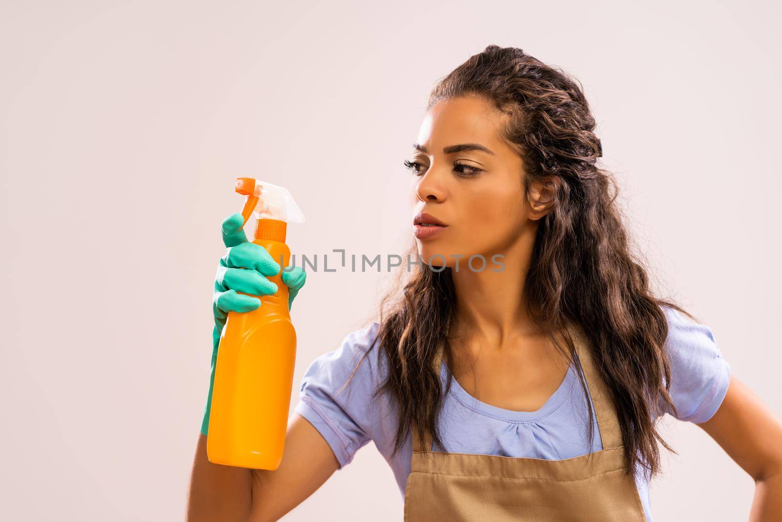Portrait of african-american housewife who is obsessed with cleaning.