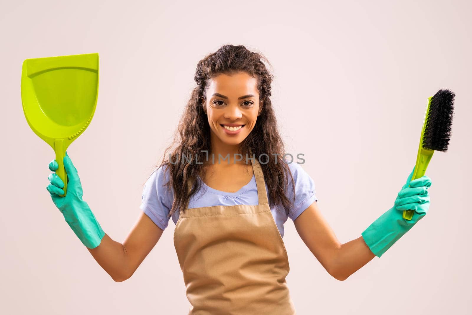Portrait of happy and successful african-american professional maid.
