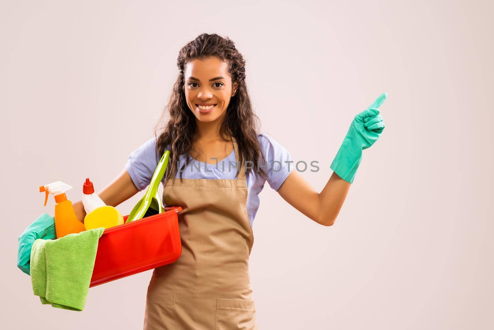 Portrait of african-american professional maid who is ready for housework.