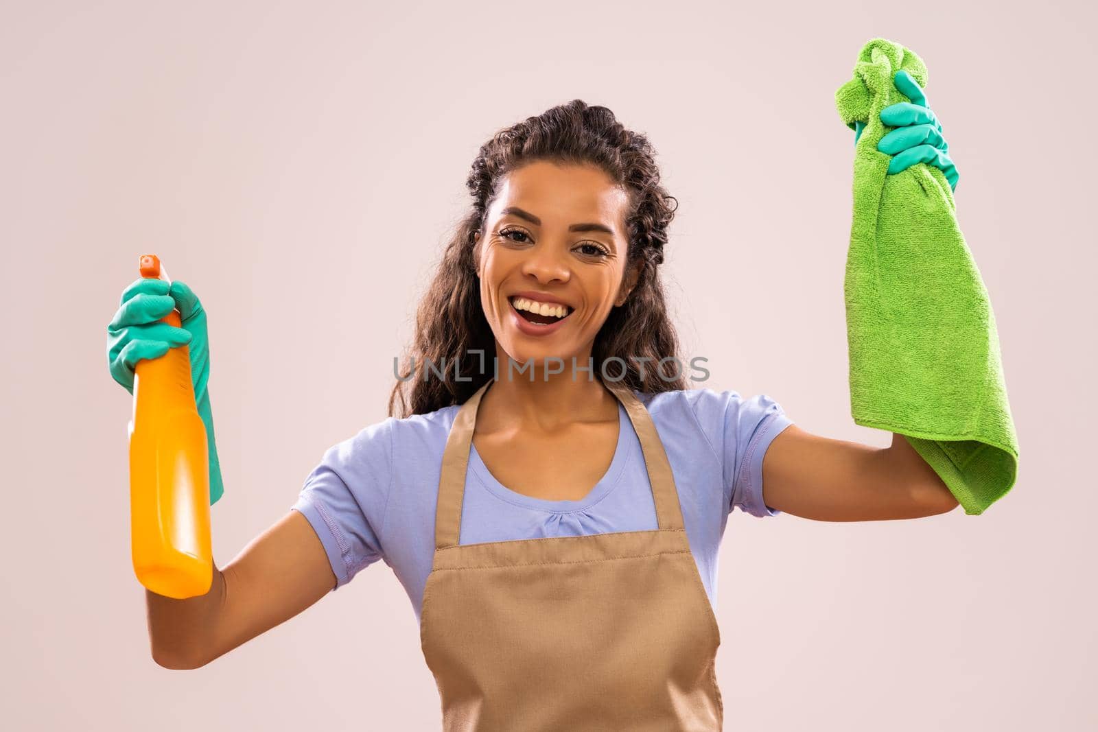 Portrait of happy and successful african-american housewife who is ready for housework.