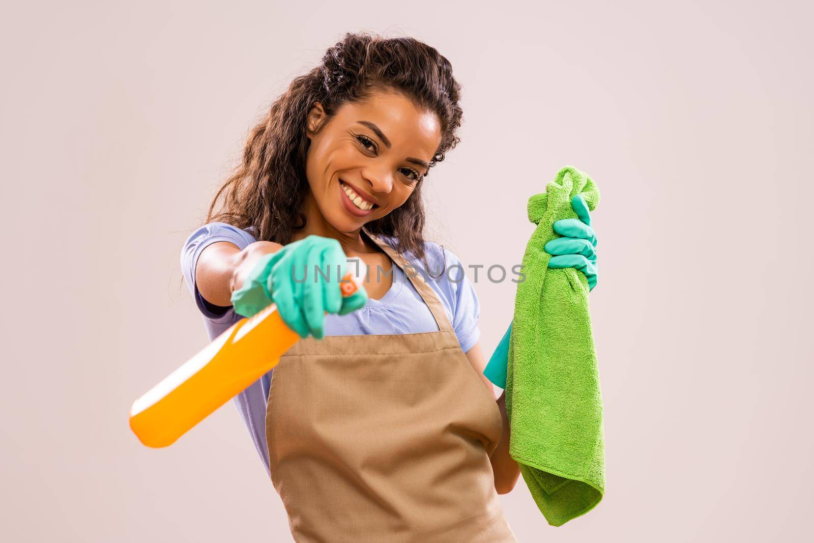 Portrait of happy and successful african-american housewife who is ready for housework.