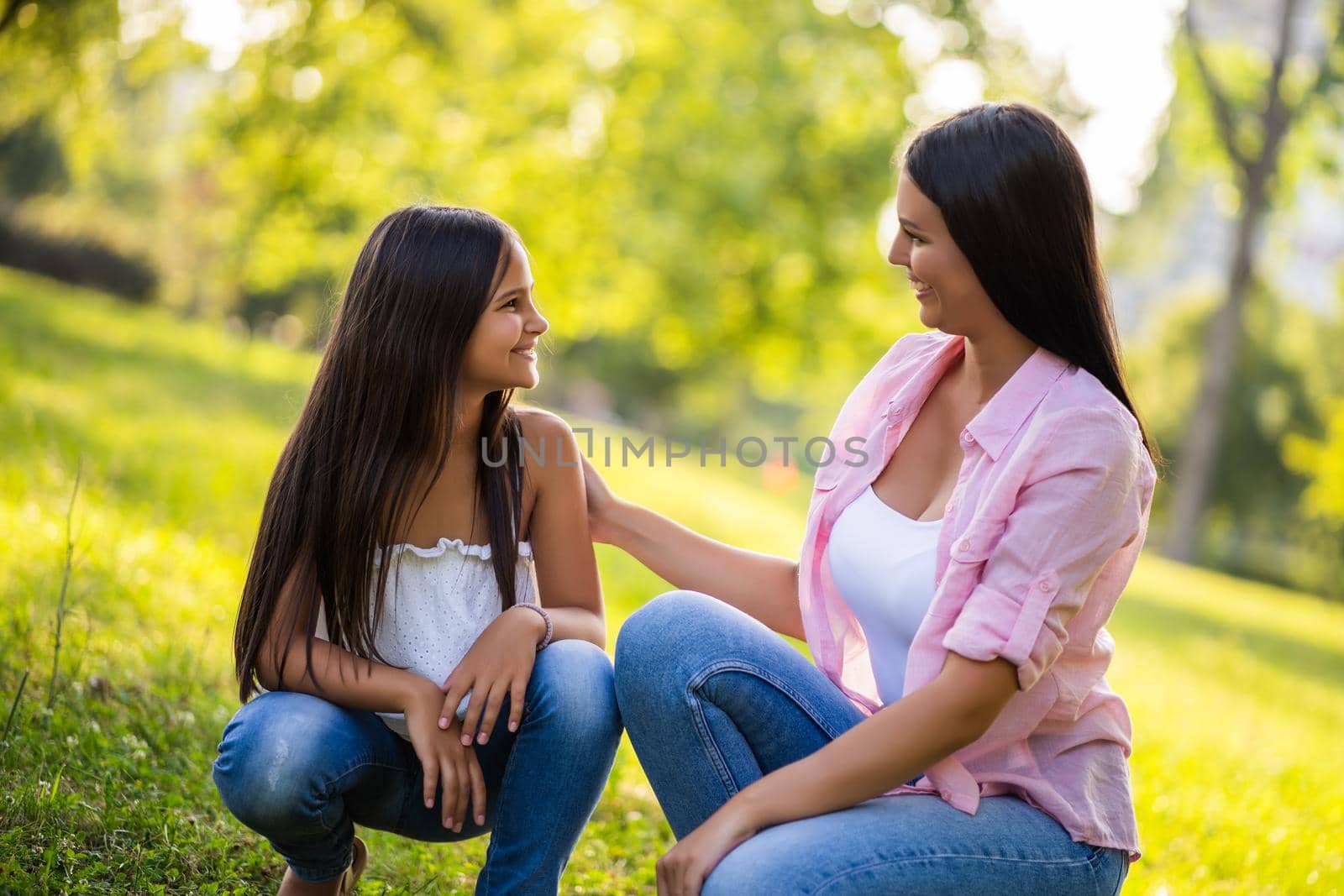 Happy family having nice time in park together.