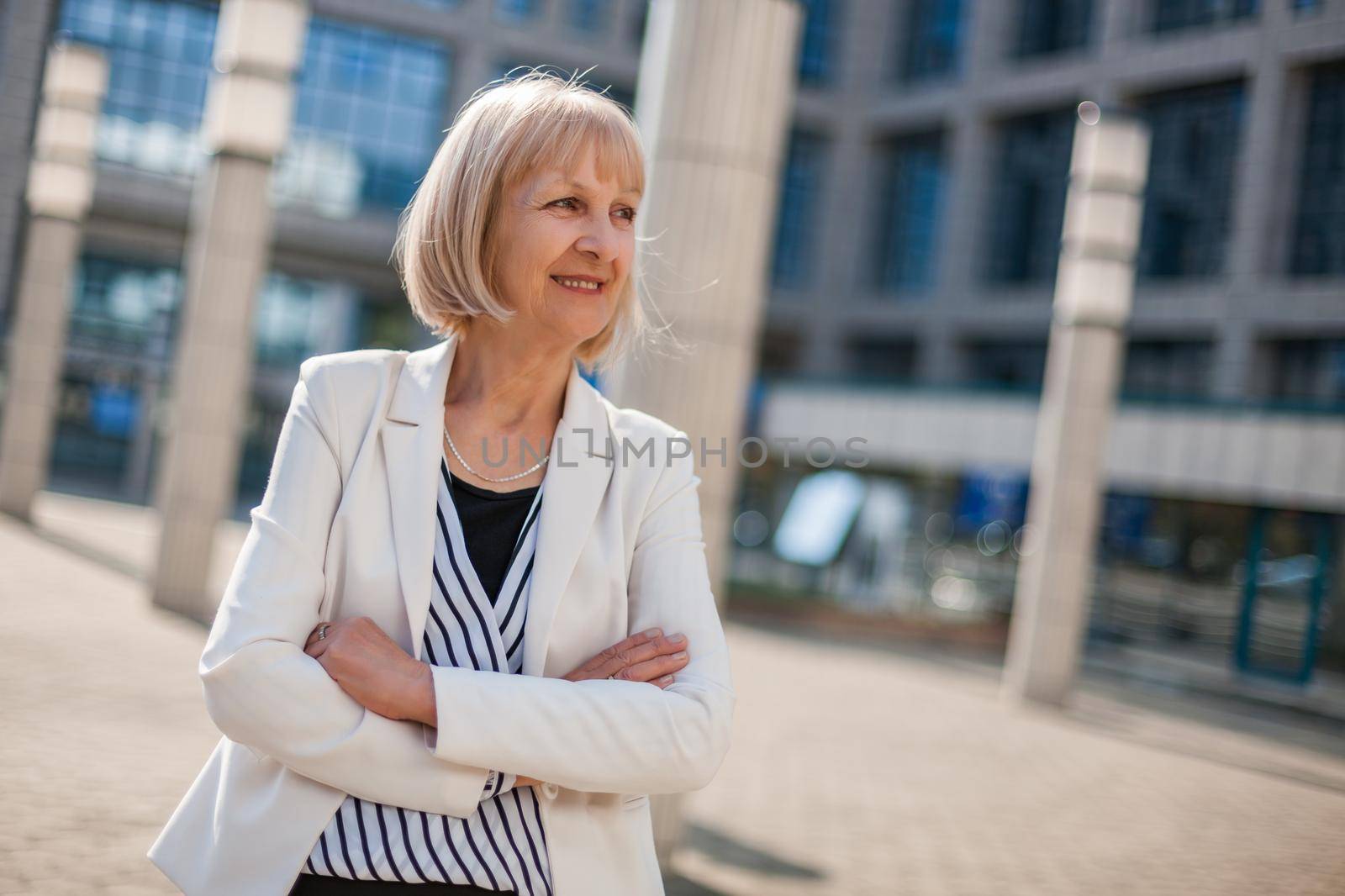 Outdoor portrait of happy senior businesswoman.