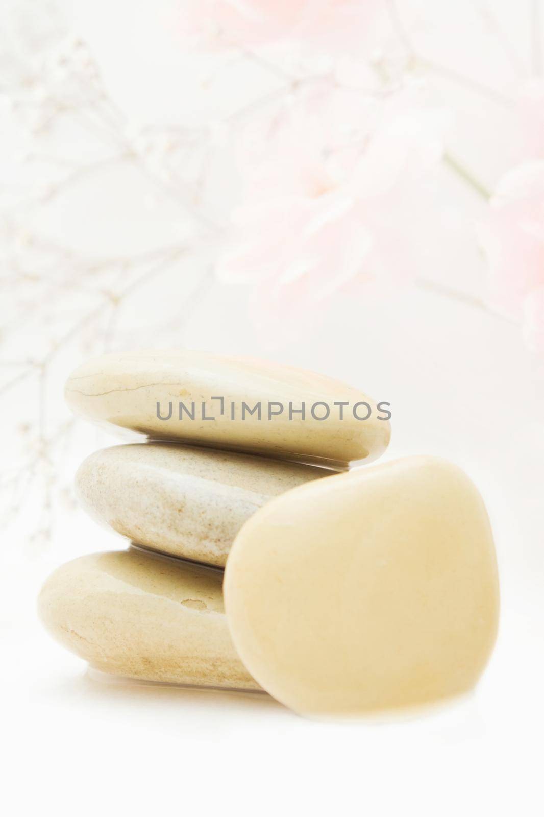 pile of hot massage stones - beauty, spa and body care styled concept, elegant visuals