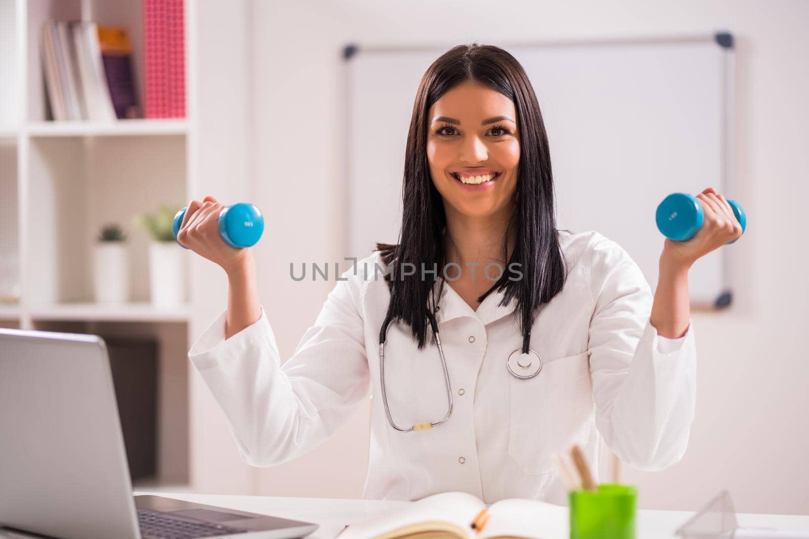Young doctor is talking about importance of fitness.