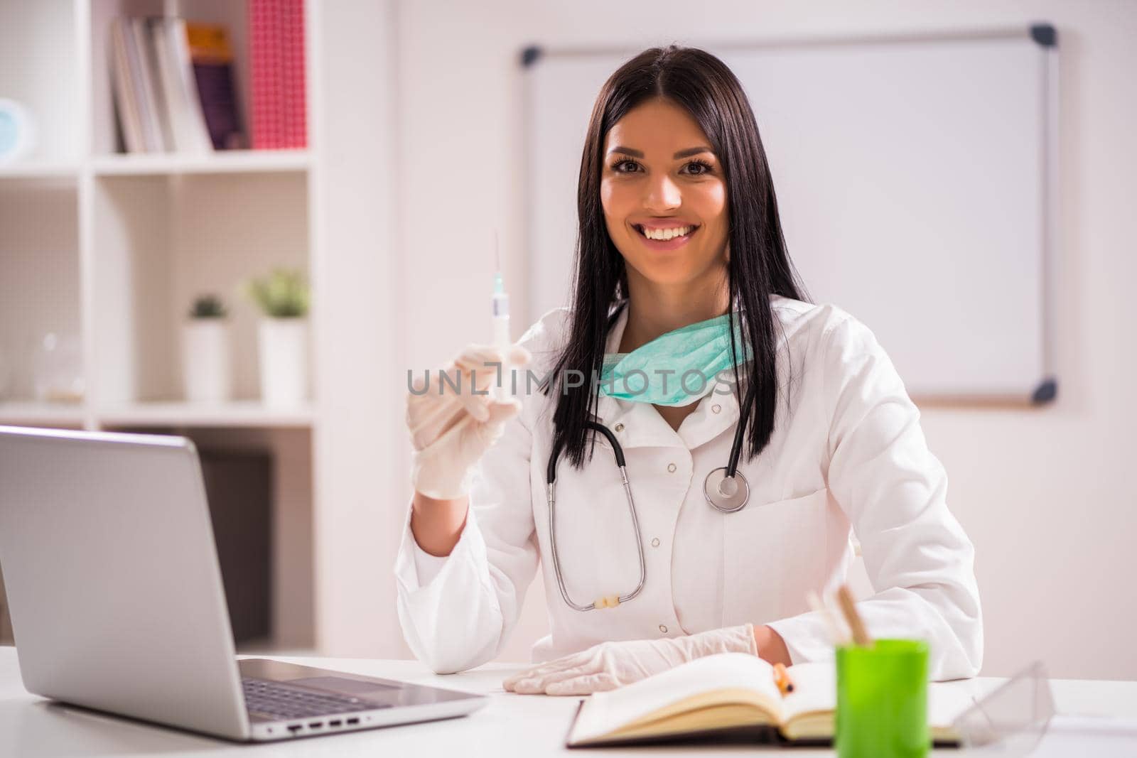 Young doctor is talking about importance of vaccination.