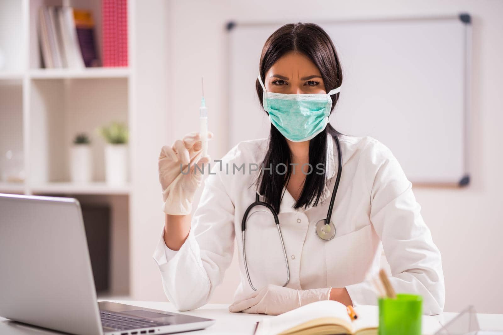 Young doctor is talking about importance of vaccination.