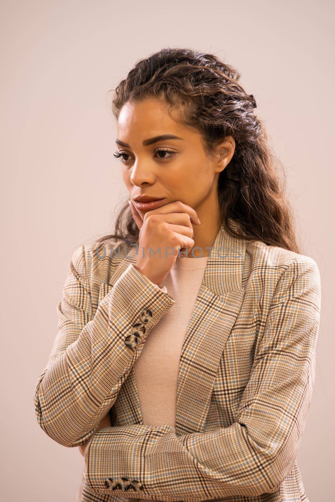 Studio shot portrait of worried african-american ethnicity businesswoman.