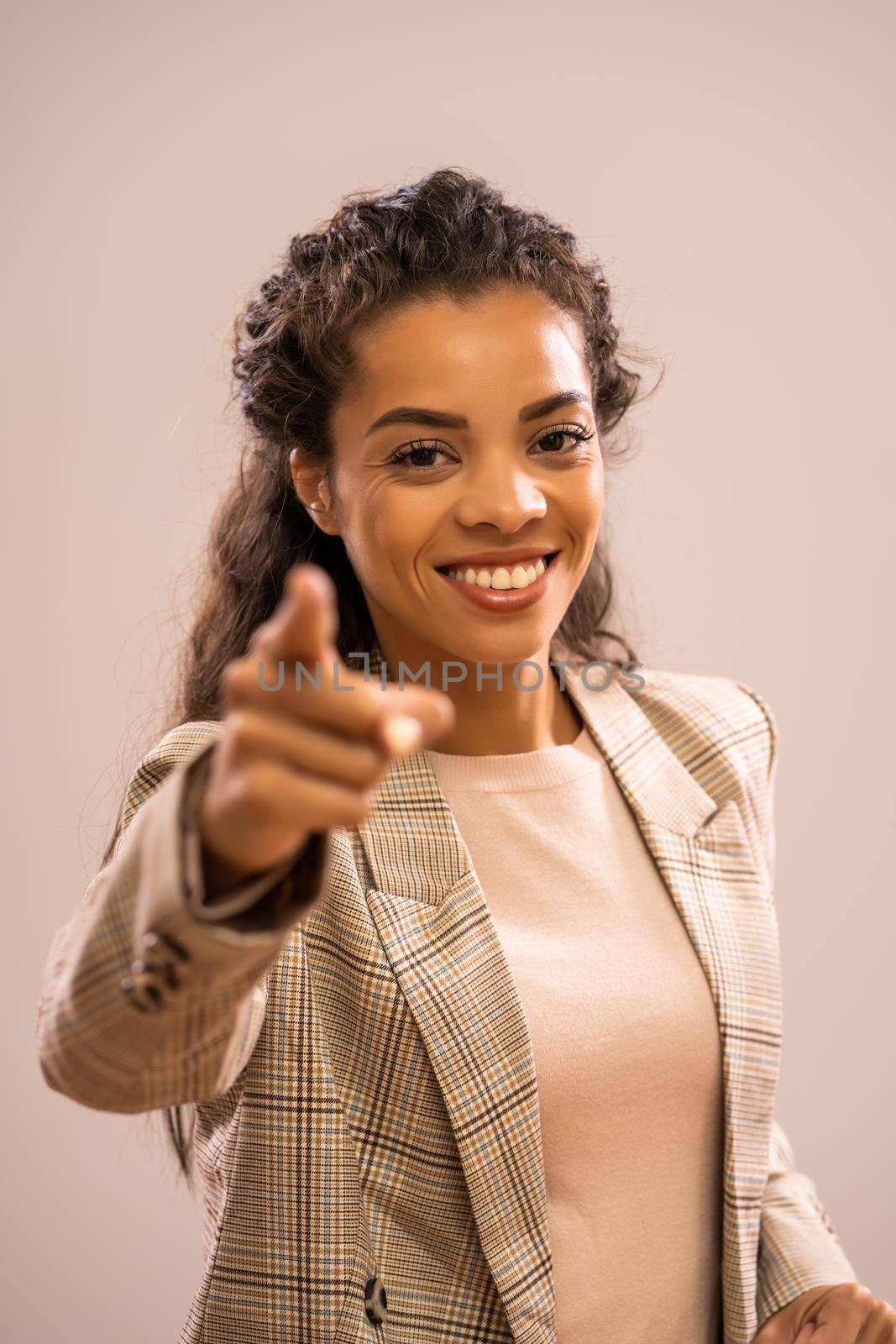 Studio shot portrait of beautiful happy african-american ethnicity businesswoman.