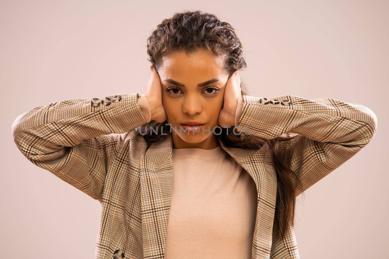 Studio shot portrait of overworked and tired african-american ethnicity businesswoman.